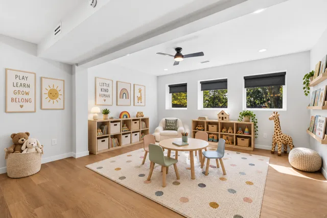 Lower-level flex room — virtually staged as a playroom. Furnishings and décor shown are digitally added.